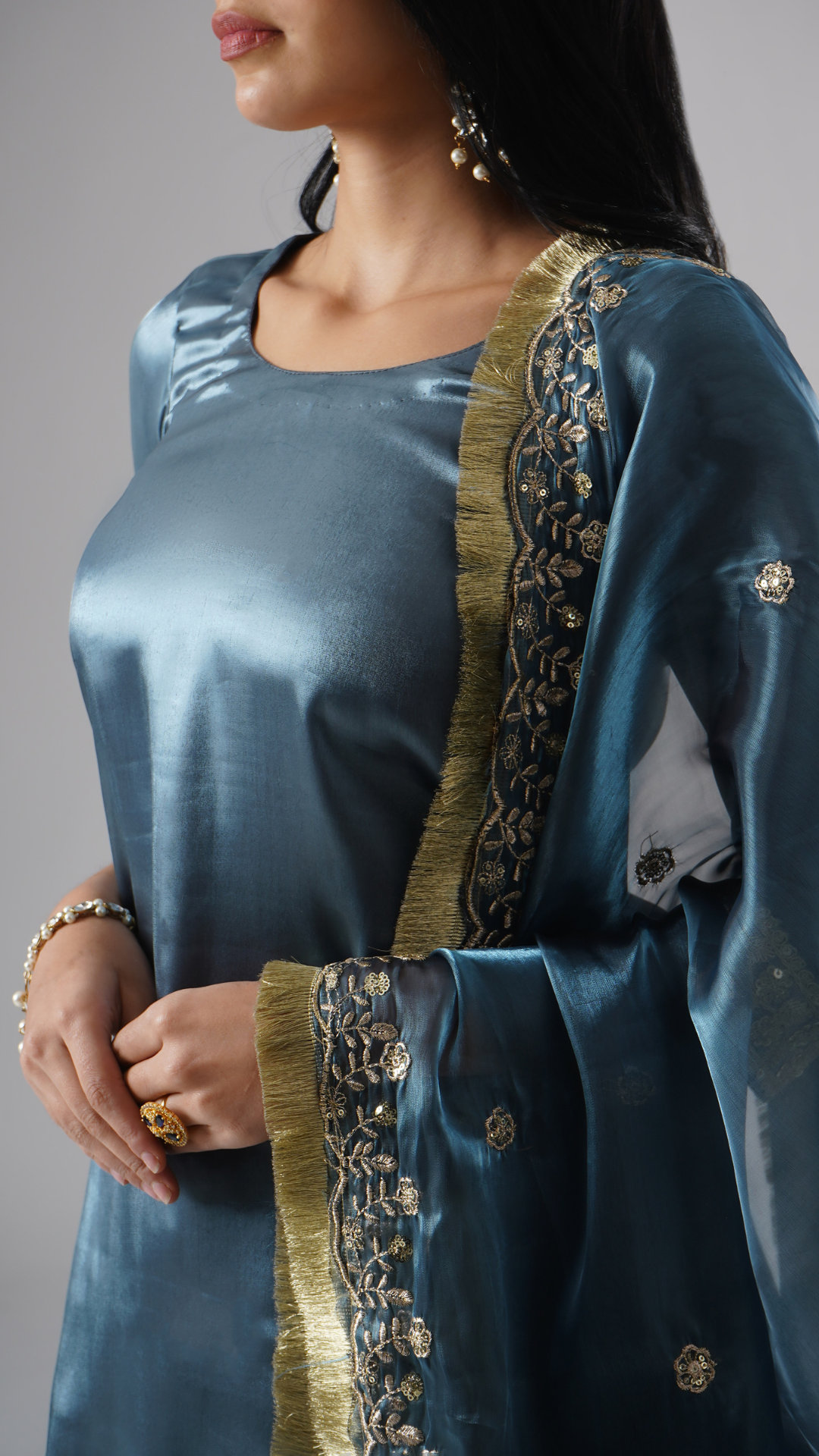 Detailed close-up showcasing the intricate dupatta design and fine fabric of the kurta in Zahrat’s Tehzeeb-e-Aab teal blue gharara set.