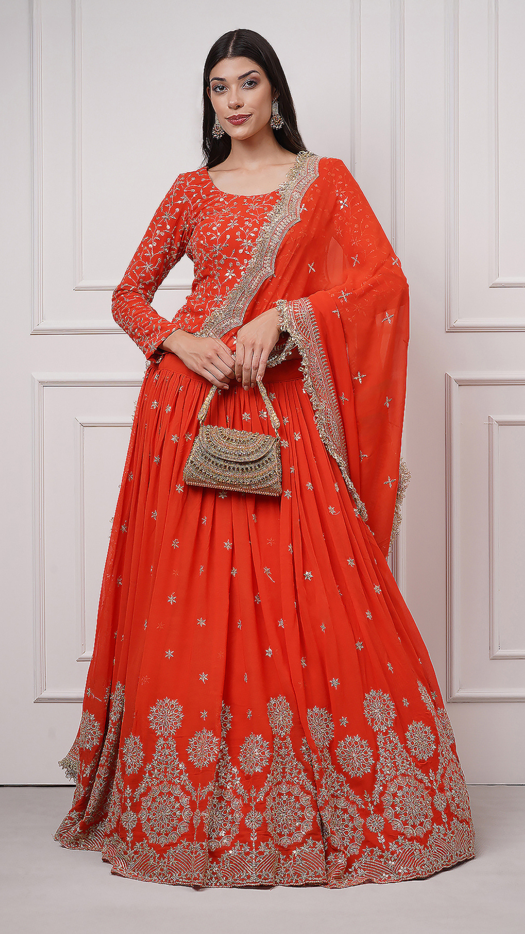 Lifestyle shot of a model wearing Close up shot of Ravayah: Amber Dusk Embroidered Lehenga - Zahrat Lehenga. 