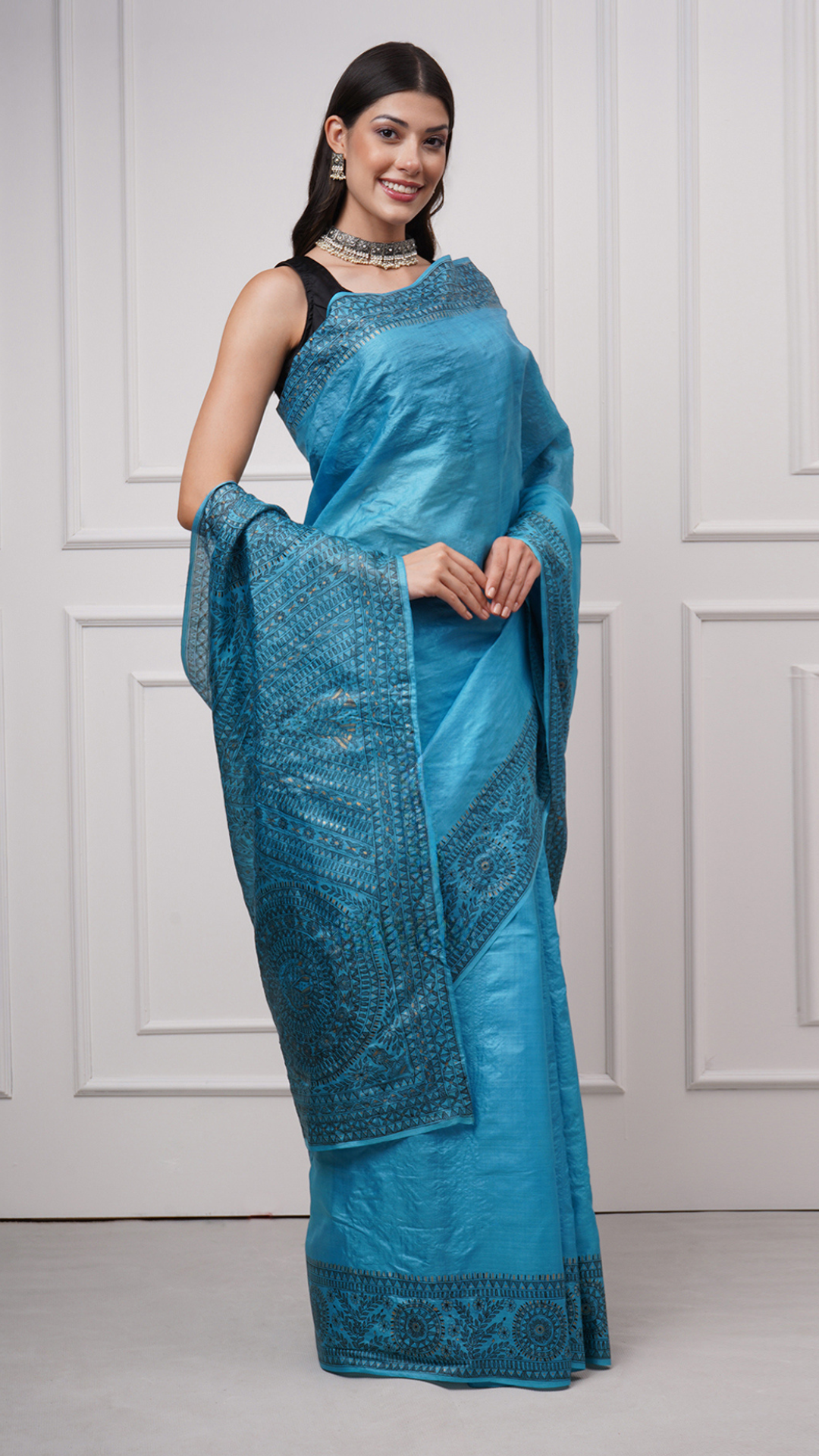 Right side view of Neelambara – Azure Madhubani Silk Saree by Zahrat displaying intricate fish and geometric motifs with a graceful fluid drape.