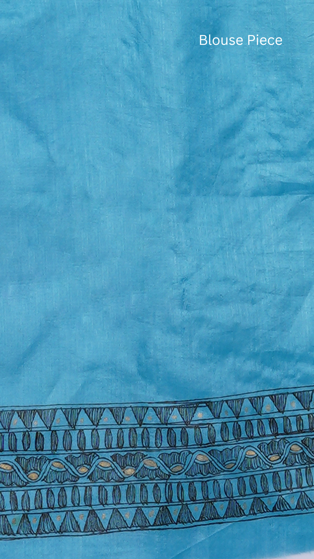 Unstitched blouse piece detail shot of Neelambara – Azure Madhubani Silk Saree by Zahrat, highlighting fabric texture and coordinated design aesthetics.