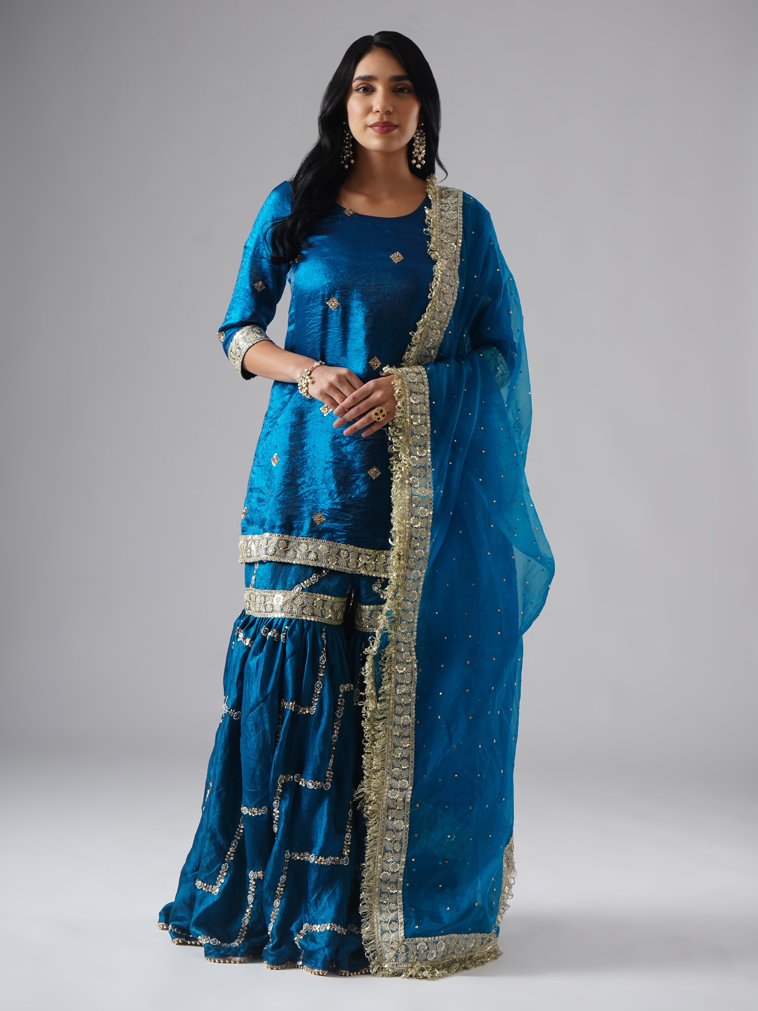 Neelafshan – The Teal Sapphire gharara set by Zahrat worn by model, front view featuring the complete ensemble with dupatta.