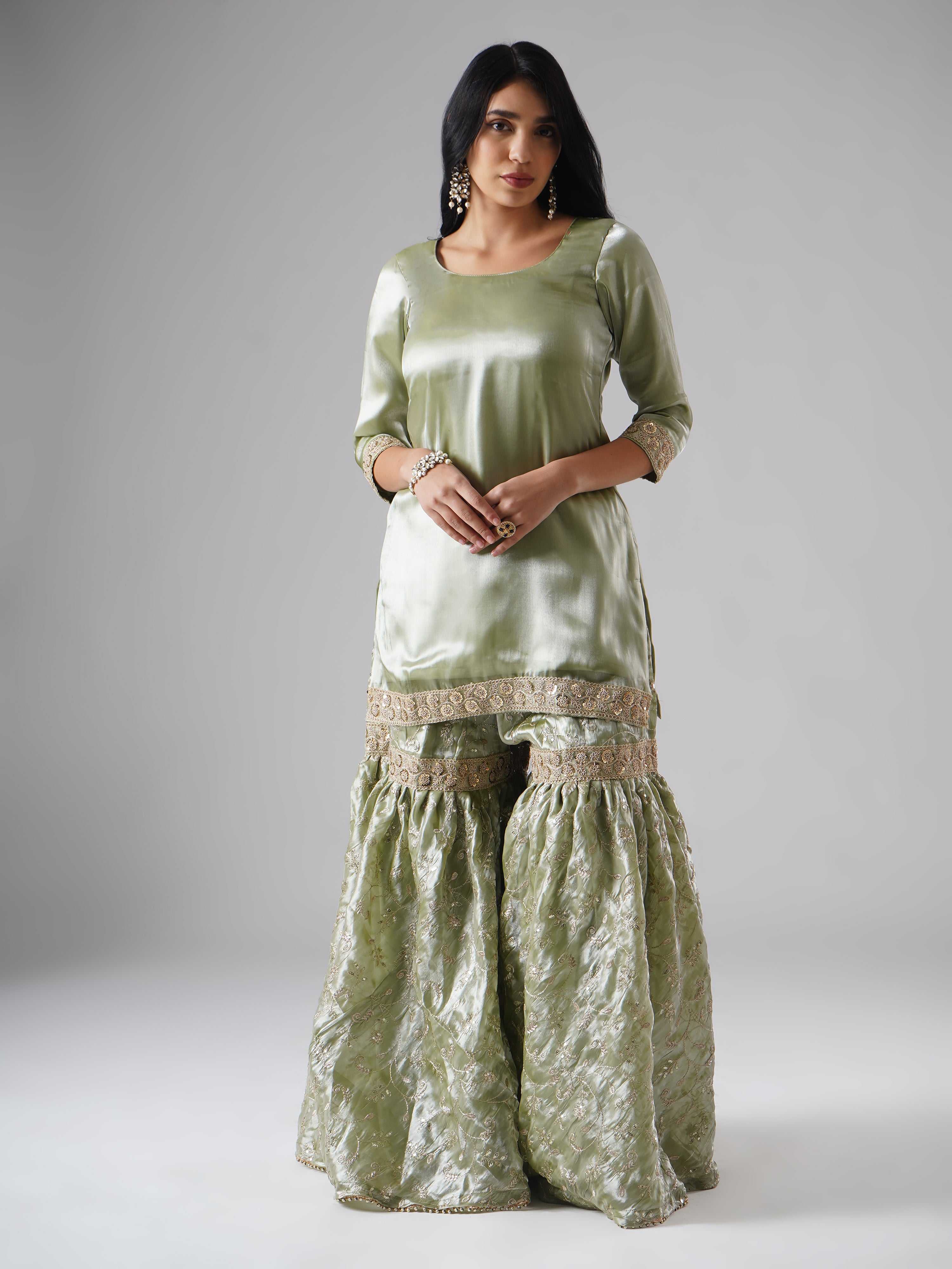 Model styled in the Mehr-e-Zaytuni – The Olive Whisper gharara set by Zahrat, front view highlighting the gharara and kurta without dupatta.