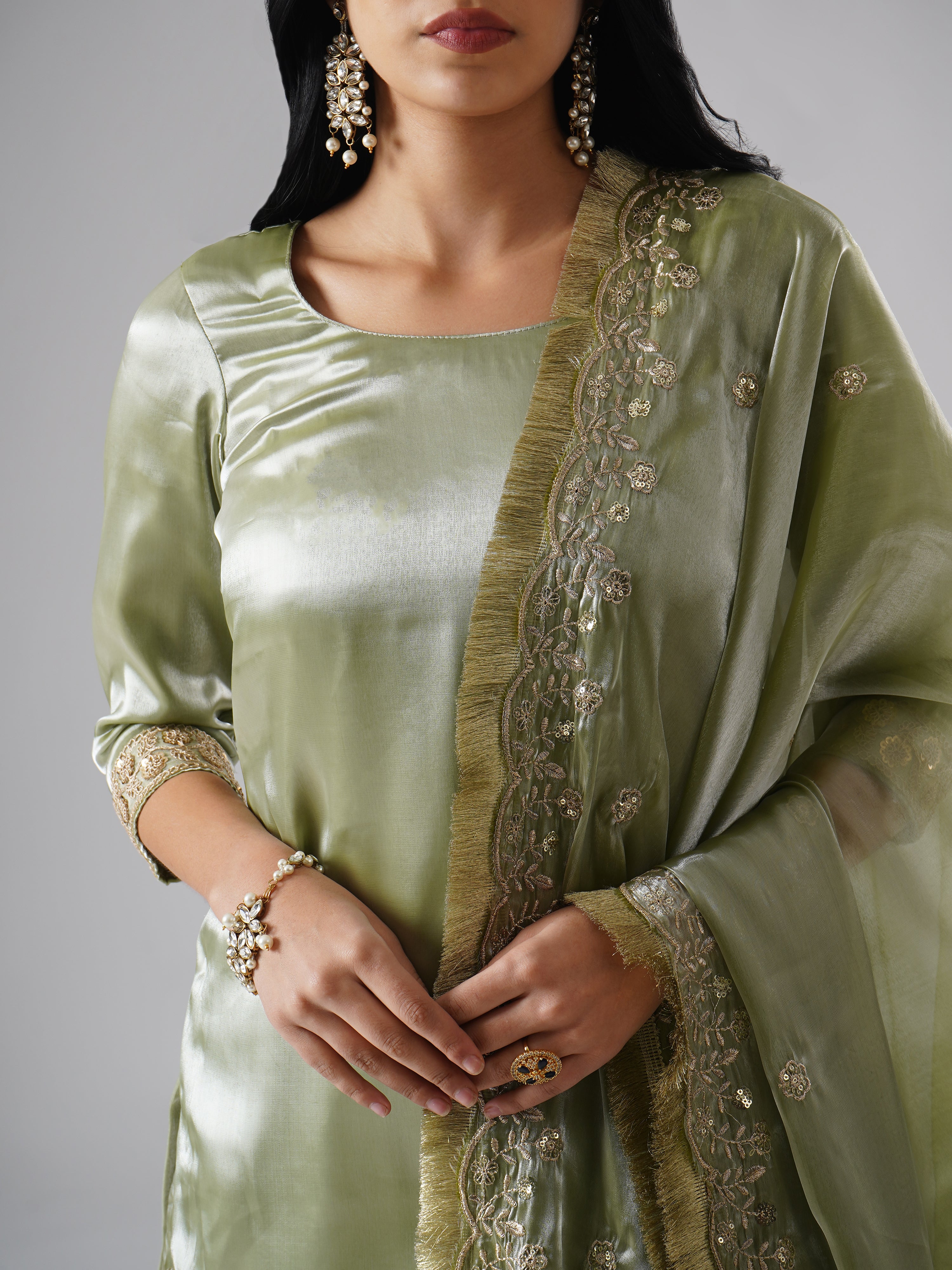 Close-up of Zahrat’s Mehr-e-Zaytuni – The Olive Whisper gharara set, highlighting the dupatta design and kurta fabric texture.