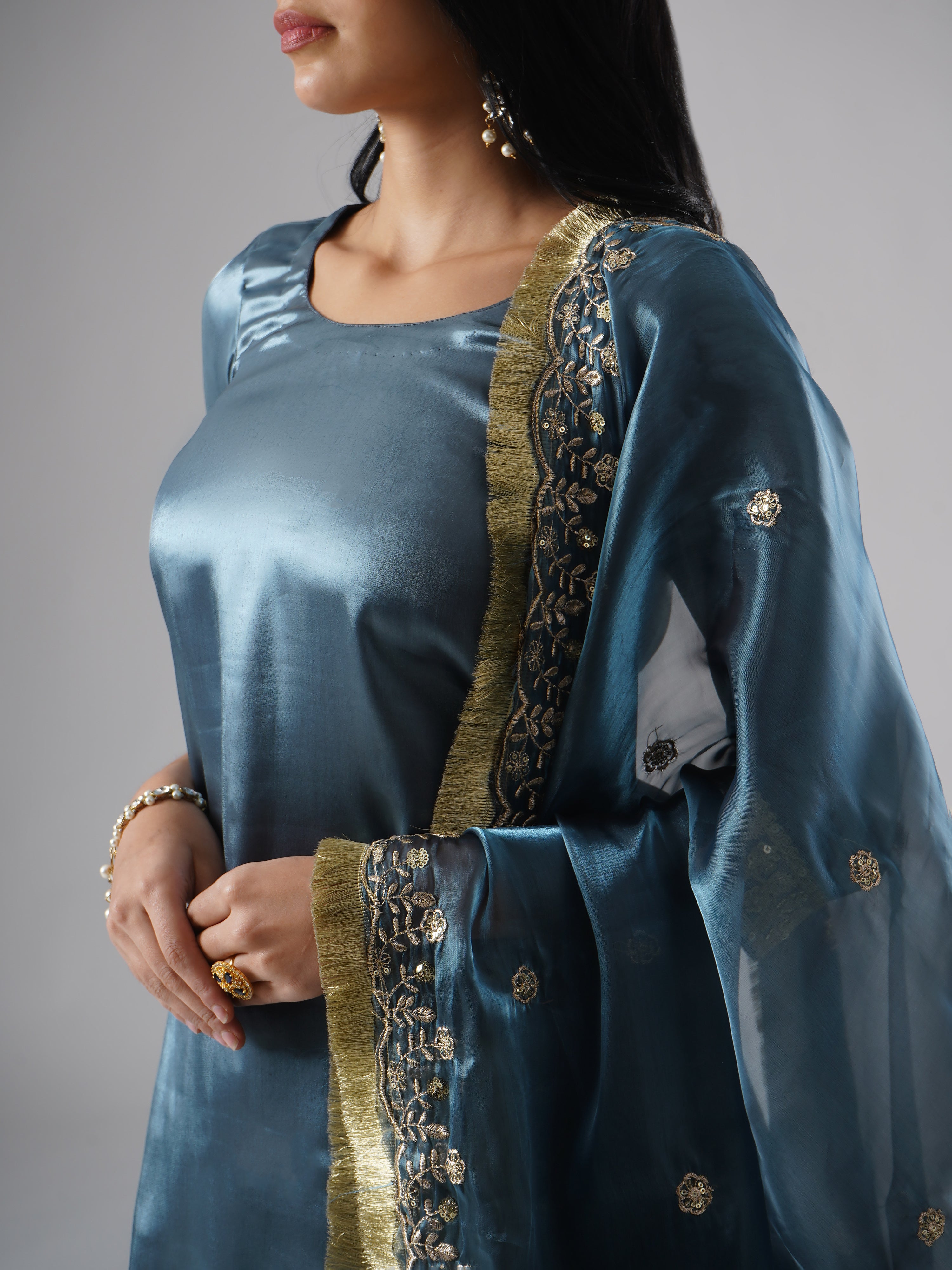 Detailed close-up showcasing the intricate dupatta design and fine fabric of the kurta in Zahrat’s Tehzeeb-e-Aab teal blue gharara set.