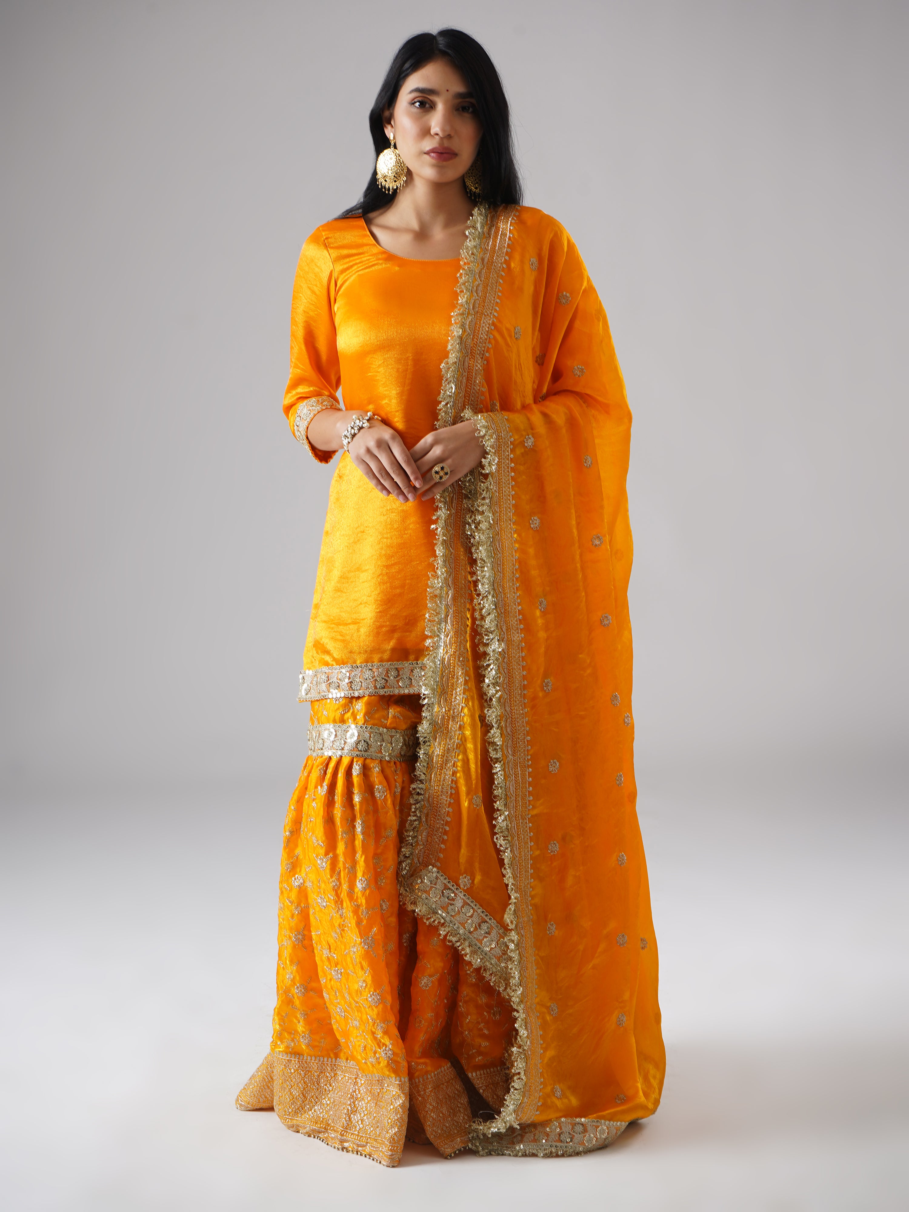 Model wearing Zahrat’s Mehrigold gharara set, front view showcasing the complete ensemble with gharara, kurta, and dupatta.