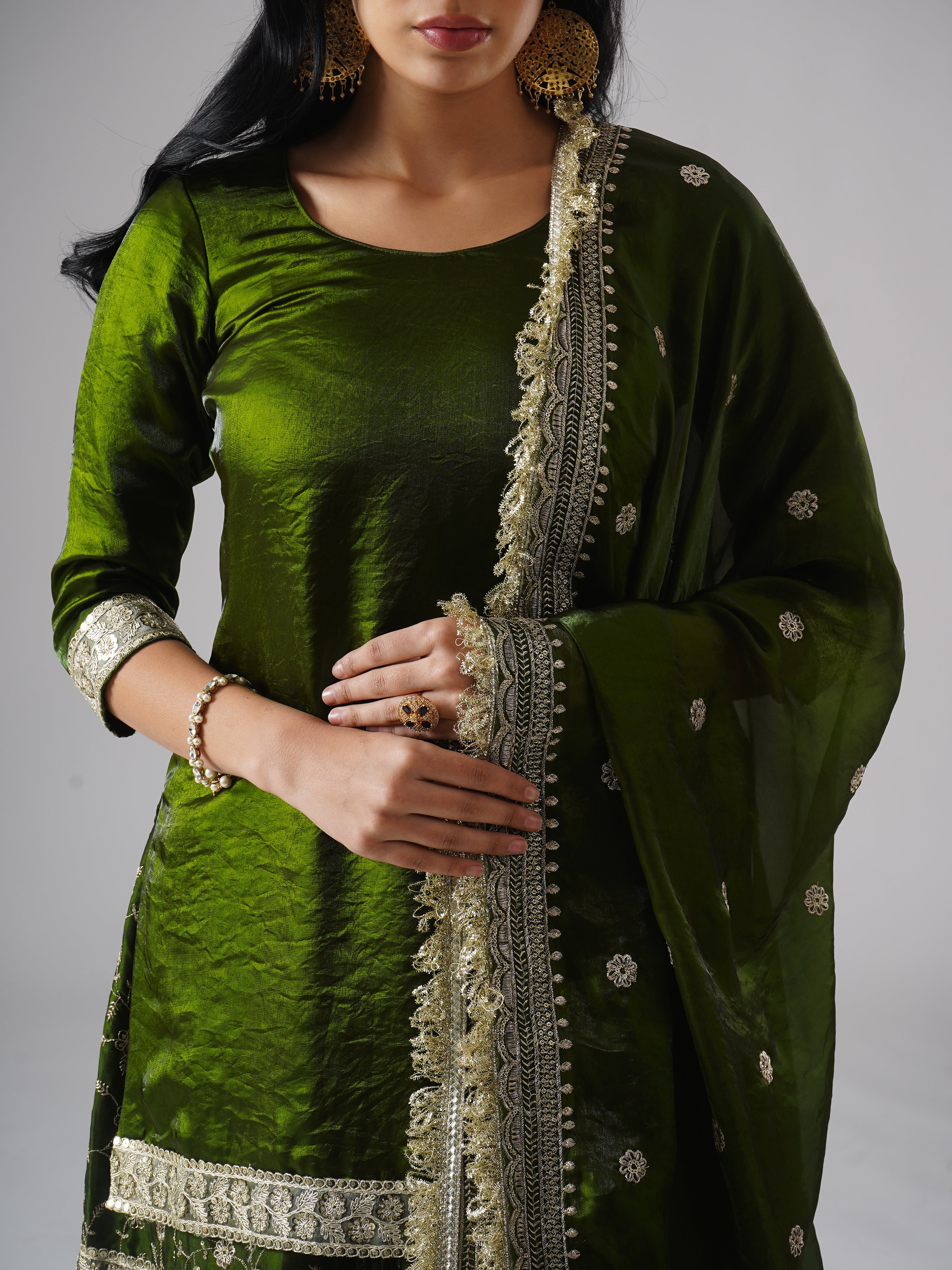 Khushrang Henna jewel-toned henna green gharara set by Zahrat, close-up highlighting kurta fabric and dupatta embroidery details.