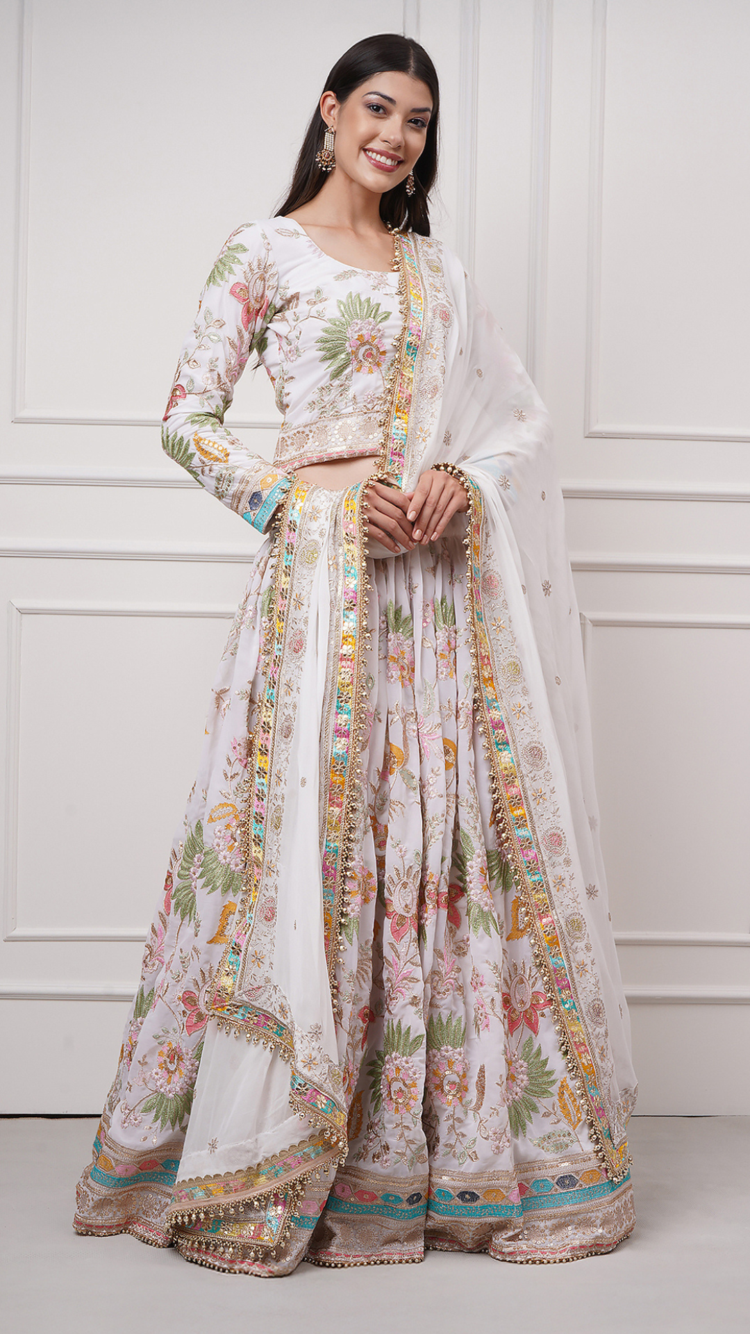 A woman models Eira Bloom Lehenga Set - Zahrat White Lehenga  Front view