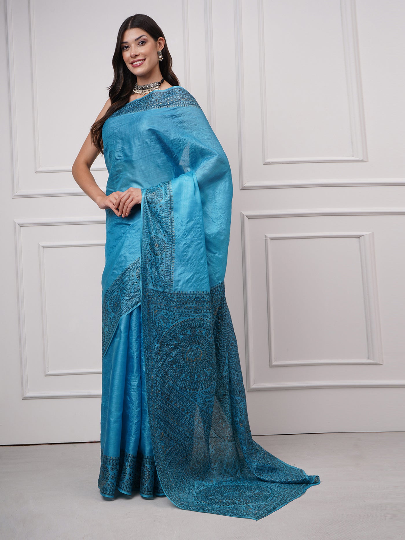 Left side view of Neelambara – Azure Madhubani Silk Saree by Zahrat highlighting the richly detailed Madhubani pallu and broad hand-painted border.
