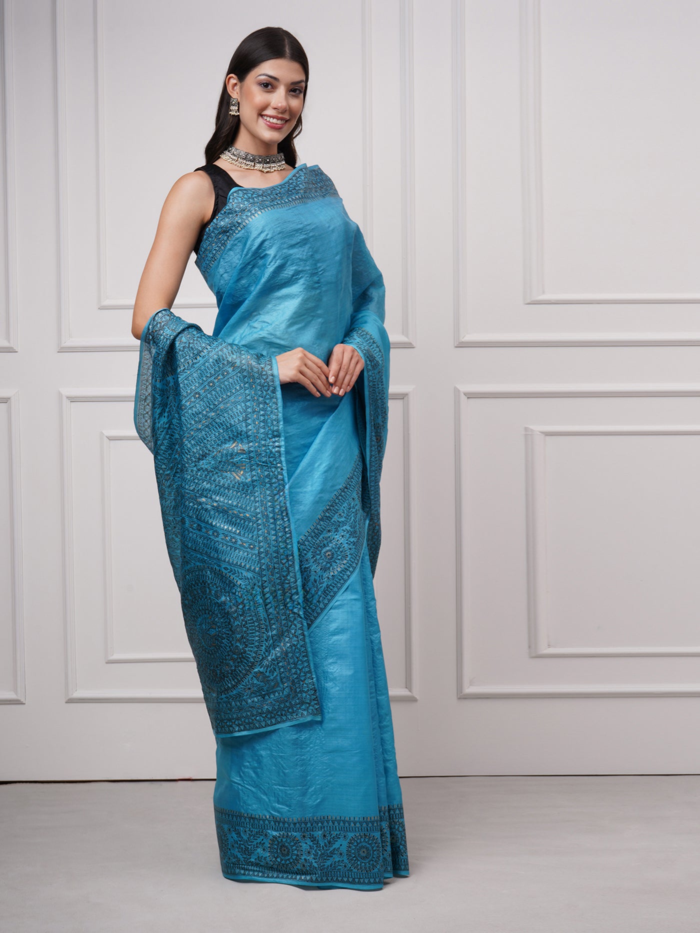 Right side view of Neelambara – Azure Madhubani Silk Saree by Zahrat displaying intricate fish and geometric motifs with a graceful fluid drape.