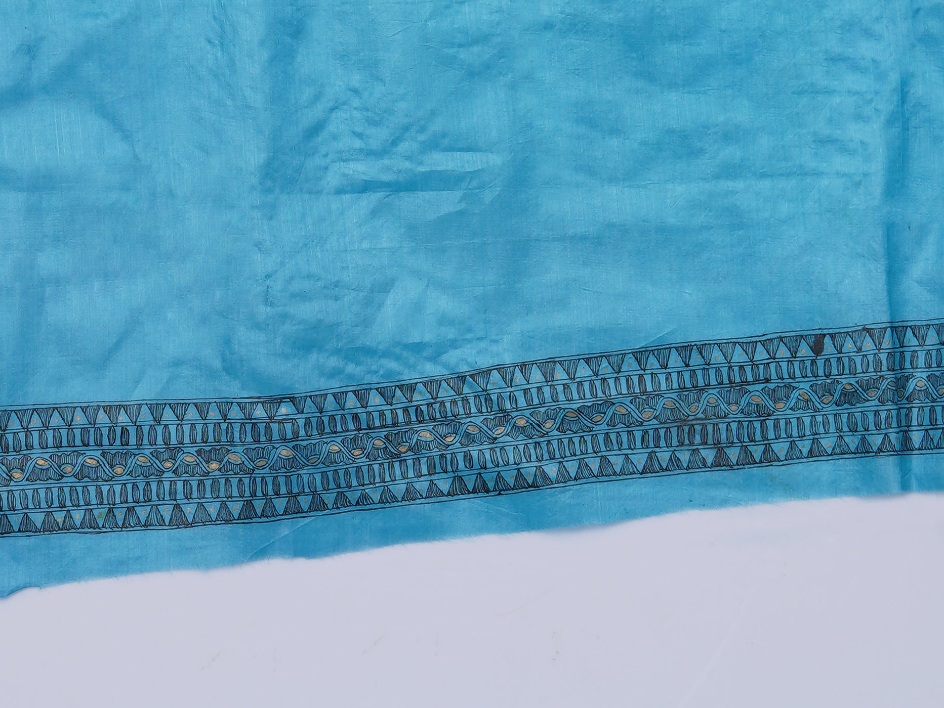 Unstitched blouse piece detail shot of Neelambara – Azure Madhubani Silk Saree by Zahrat, highlighting fabric texture and coordinated design aesthetics.