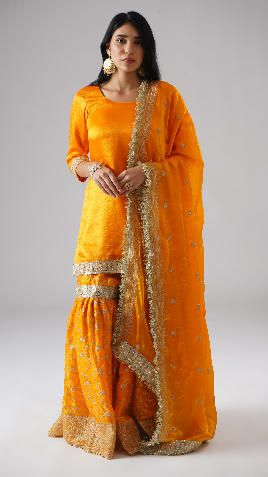 Model wearing Zahrat’s Mehrigold gharara set, front view showcasing the complete ensemble with gharara, kurta, and dupatta.