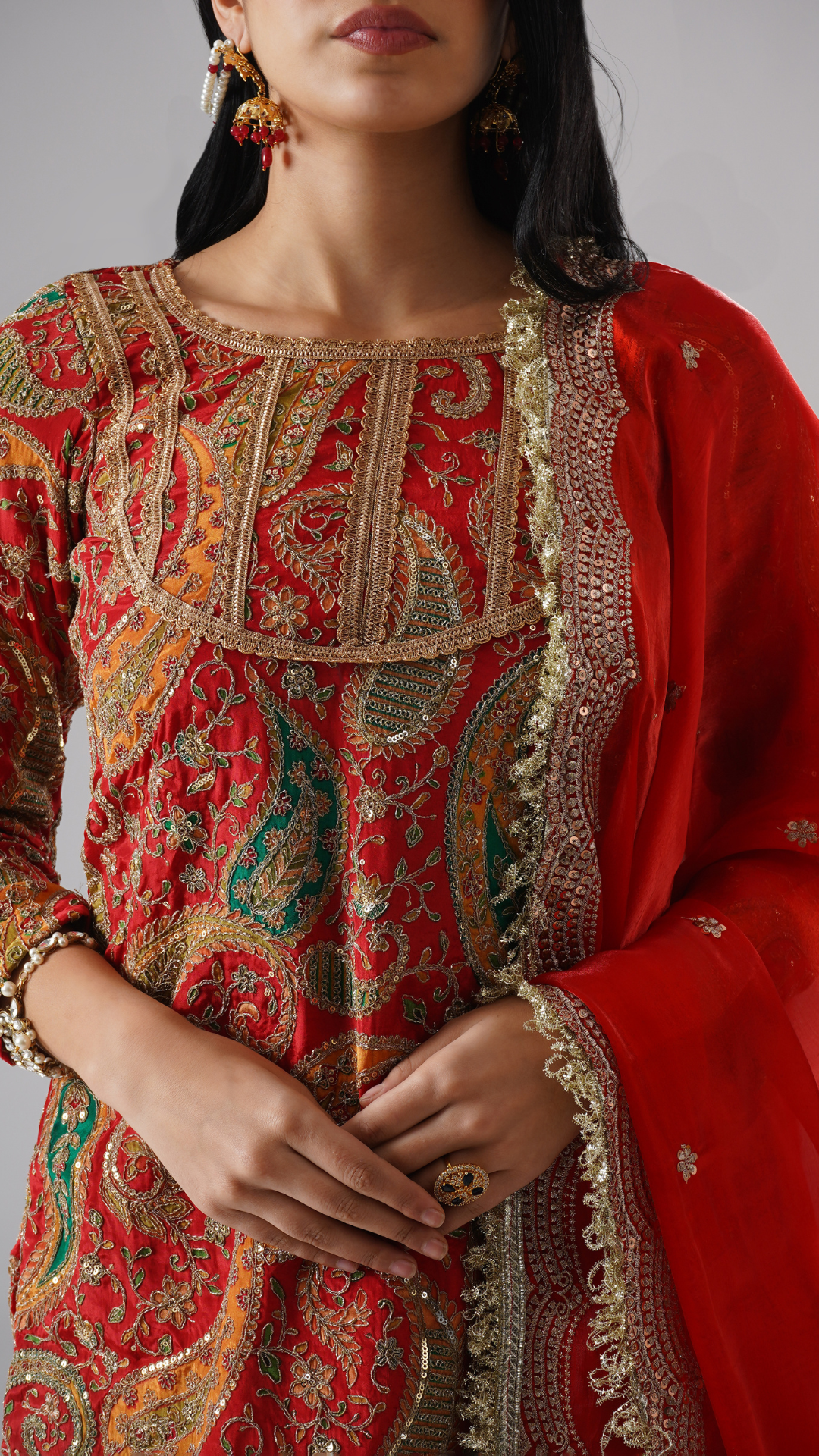Close-up of Zahrat’s Mehroza crimson red gharara set, highlighting the kurta embroidery and dupatta design details.
