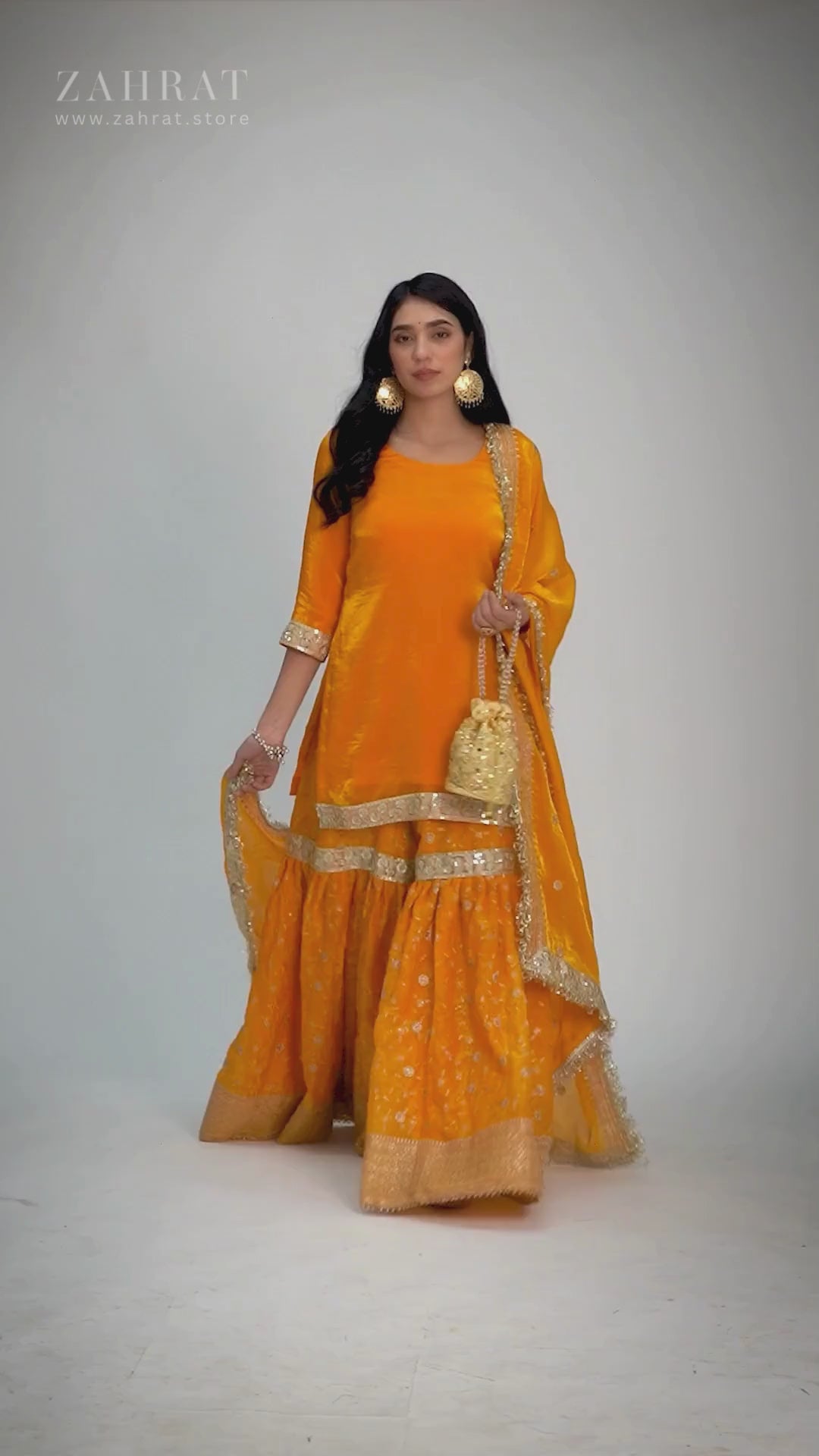 Zahrat Mehrigold Gharara – marigold yellow wedding gharara set with silver embroidery, flared pants, sleek kurta, and sheer dupatta, perfect for haldi, mehendi, and festive celebrations.