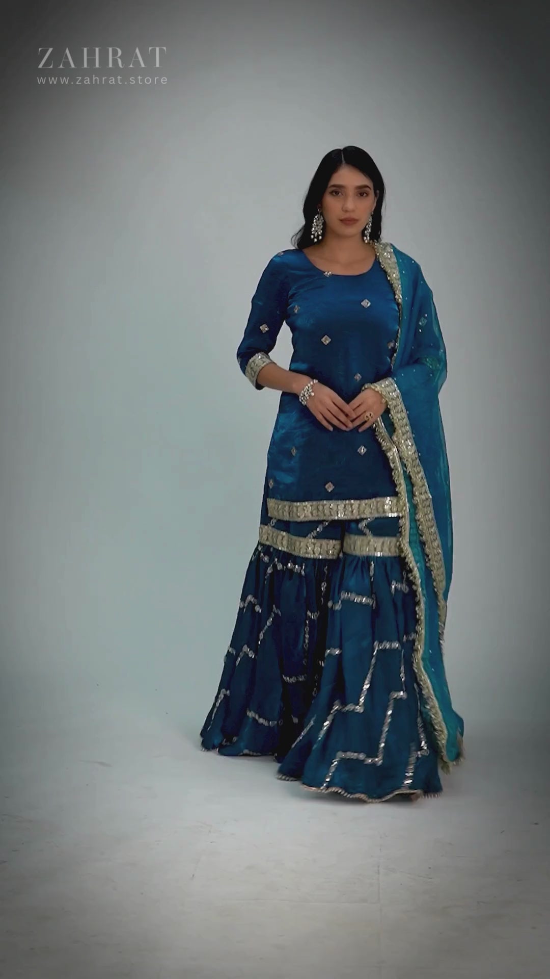 Neelafshan Teal Sapphire Gharara – modern teal wedding gharara set with flared pants, sleek embroidered kurta, and lightweight embellished dupatta, perfect for festive and wedding occasions.