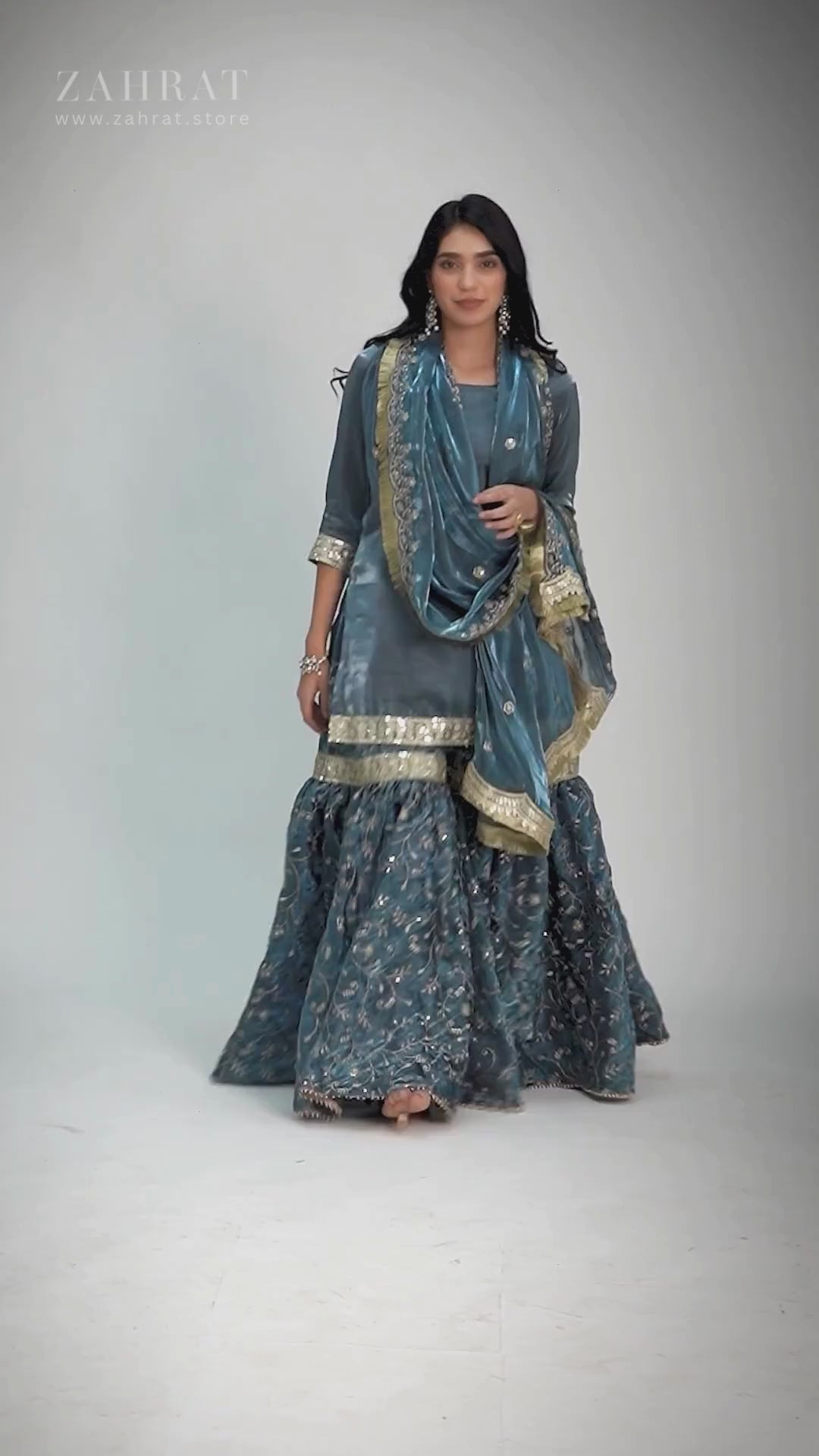 Zahrat Tehzeeb-e-Aab Gharara – teal blue wedding gharara set with golden thread embroidery, flared pants, sleek kurti, and matching dupatta, perfect for festive and wedding occasions.