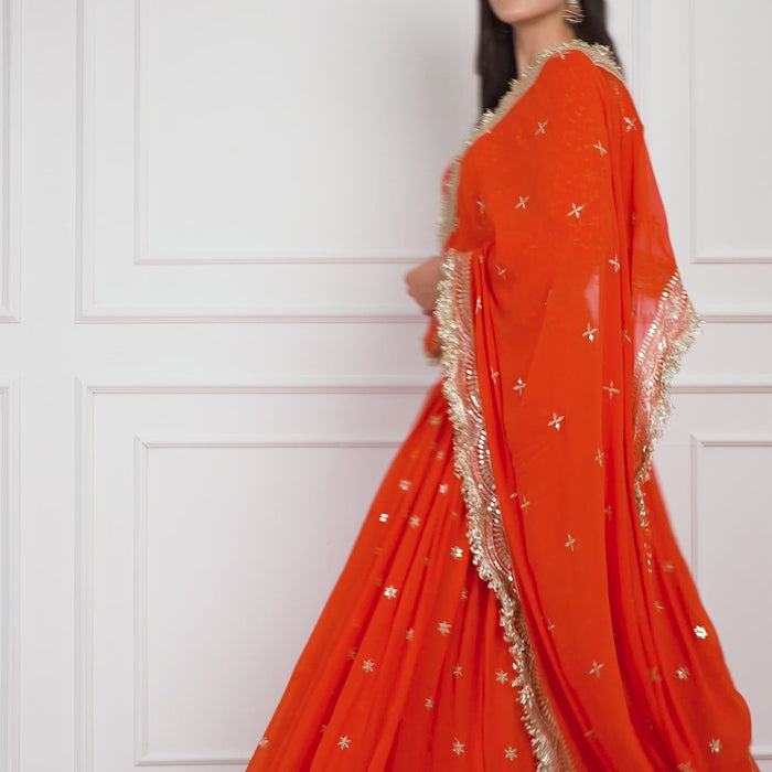 Model gracefully walking and twirling in the Amber Dusk embroidered lehenga by Zahrat, showcasing the lehenga's flow, detailed embroidery, and elegant drape of the dupatta