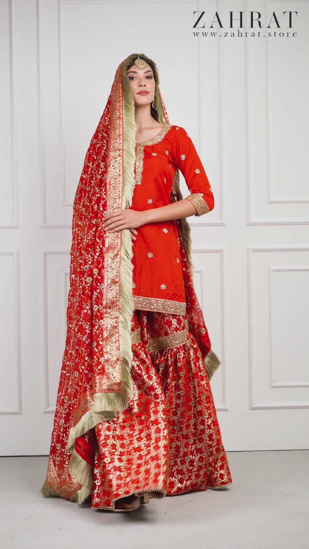 Video of a model wearing Surkhnaaz Bridal Kimkhwab Gharara by Zahrat